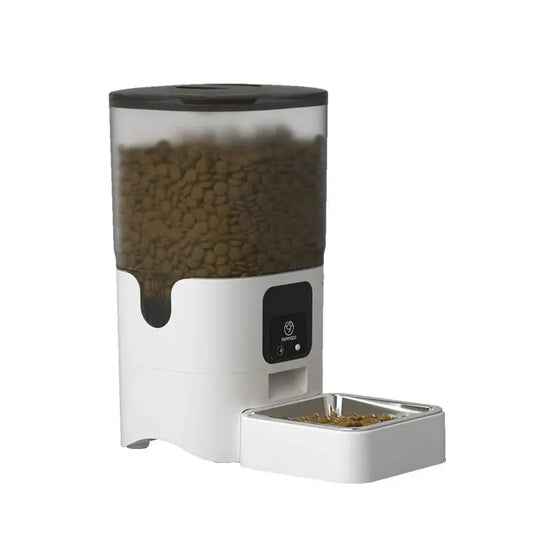 White pet food dispenser with a transparent container filled with pet food on a white background